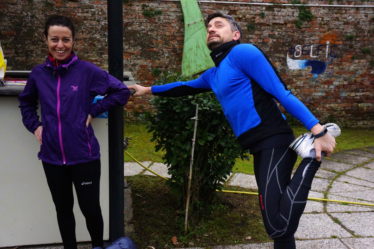 Runners doing stretching in Venice before the run