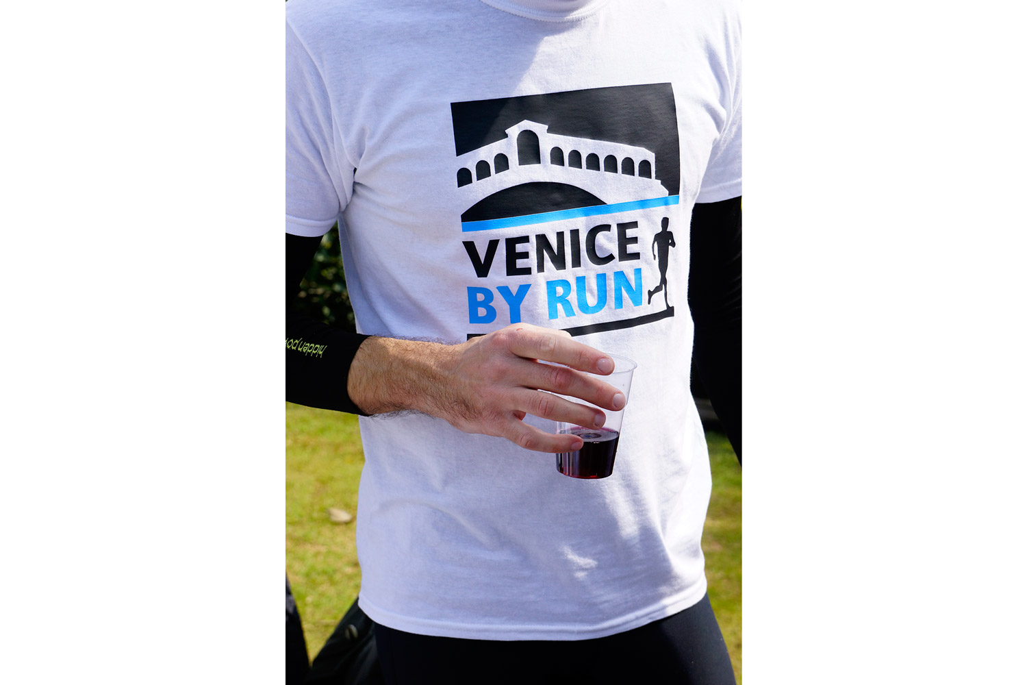 Runner drinking a glass of wine in Venice