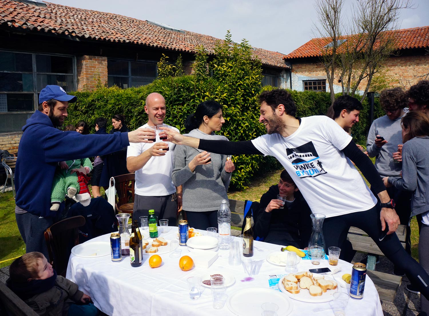 Runners having a cheers in Venice after the run